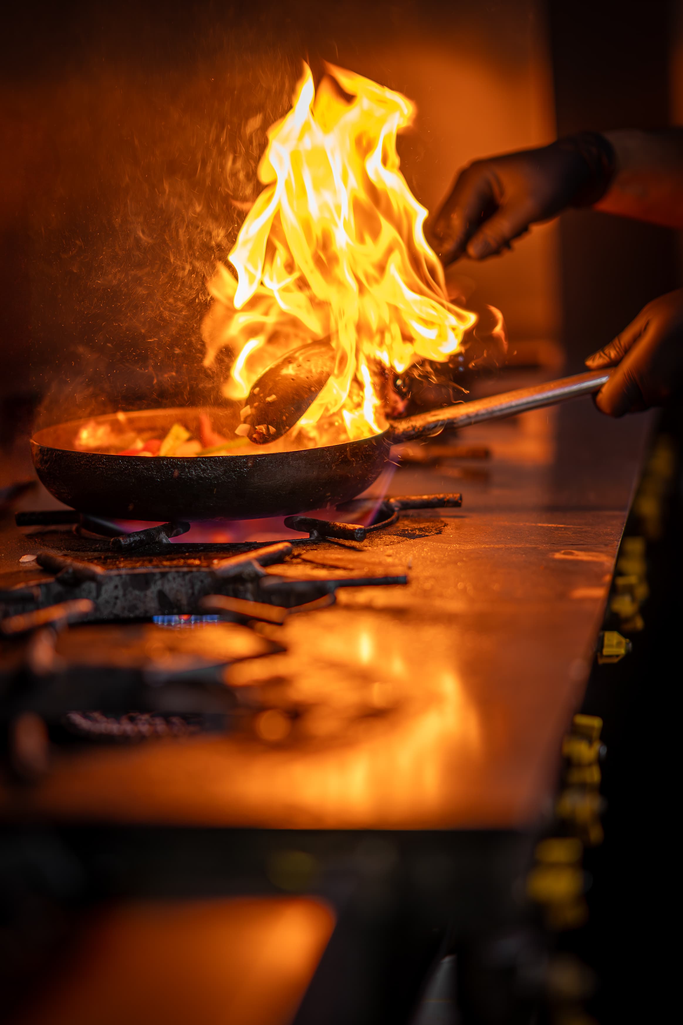 Vegetables flambéed in the kitchen